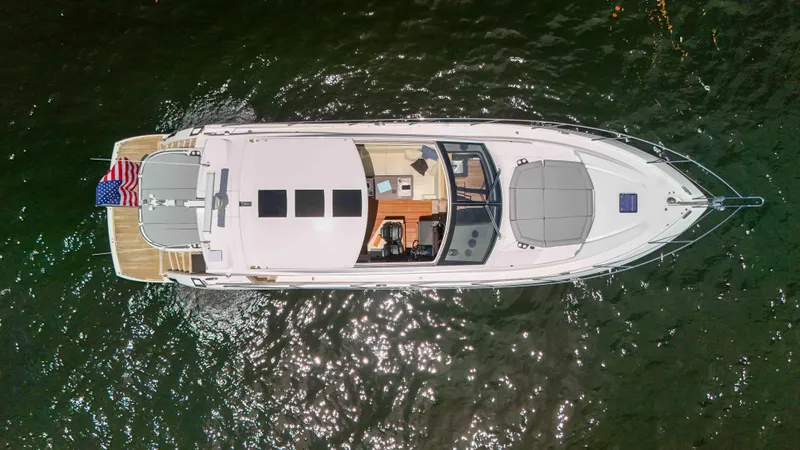 Arbitrage Yacht Photos Pics Aerial view of 2017 Sunseeker Predator 57 yacht on water.