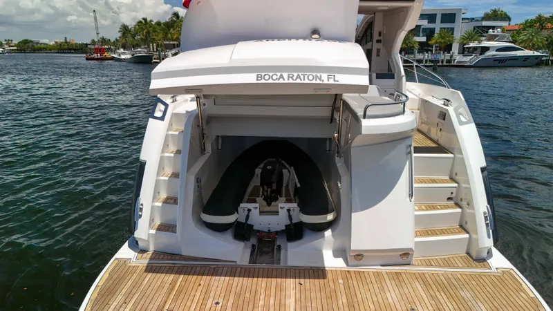 Arbitrage Yacht Photos Pics 2017 Sunseeker Predator 57 yacht with tender garage, docked in Boca Raton, FL.