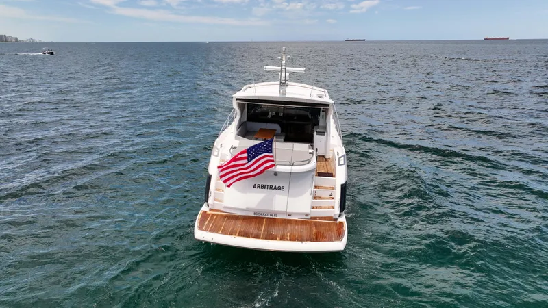 Arbitrage Yacht Photos Pics 2017 Sunseeker Predator 57 yacht on open sea with American flag.