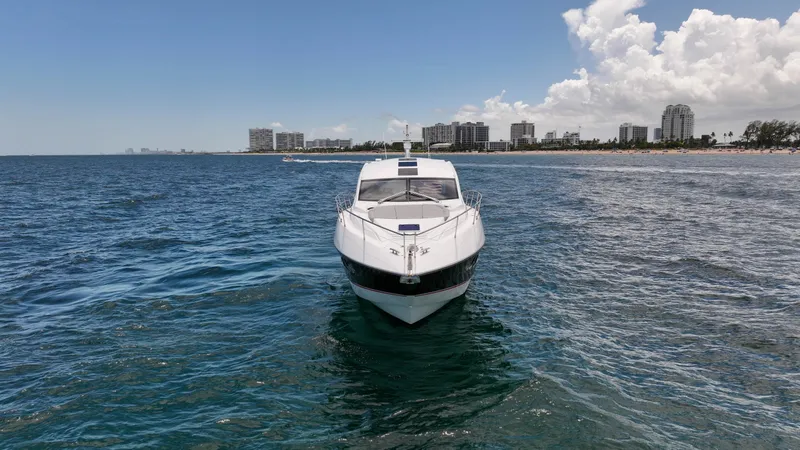 Arbitrage Yacht Photos Pics 2017 Sunseeker Predator 57 yacht on ocean near city skyline.