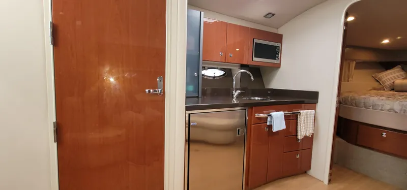  Yacht Photos Pics Interior of 2012 Formula 37 Performance Cruiser with kitchen and sleeping area.