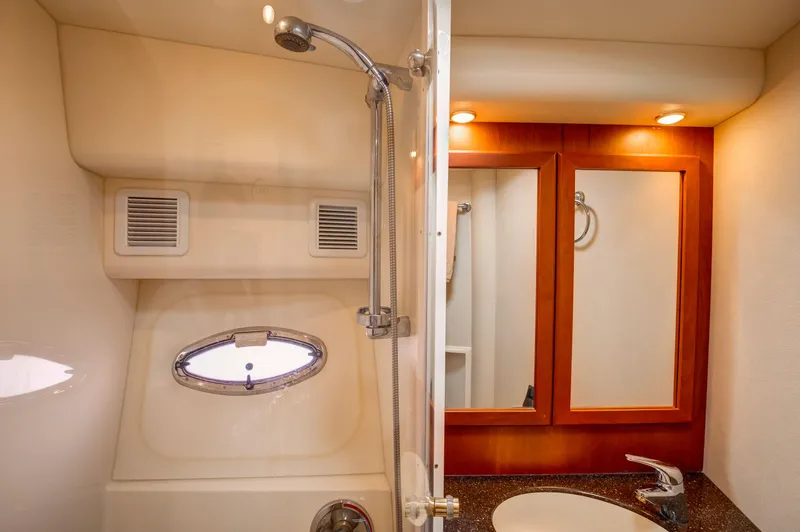 Yacht Photos Pics Bathroom interior of 2006 Silverton 50 Convertible yacht with shower and vanity.