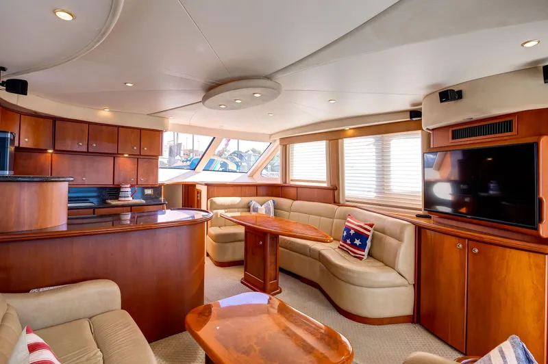  Yacht Photos Pics Luxurious interior of a 2006 Silverton 50 Convertible yacht with elegant wood finishes.