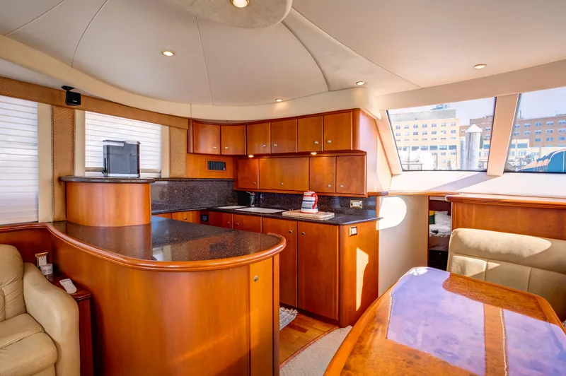  Yacht Photos Pics Luxurious interior of a 2006 Silverton 50 Convertible yacht with elegant wood finishes.