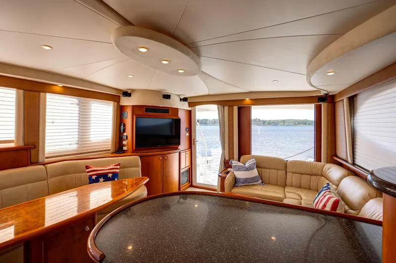  Yacht Photos Pics Luxurious interior of 2006 Silverton 50 Convertible yacht with elegant seating and scenic water view.