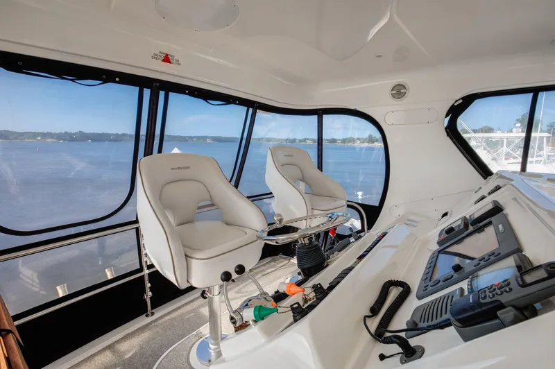  Yacht Photos Pics Interior of 2006 Silverton 50 Convertible yacht with helm and panoramic windows.