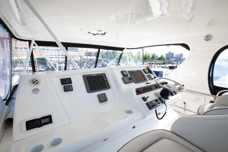  Yacht Photos Pics Interior helm of 2006 Silverton 50 Convertible yacht with modern navigation equipment.