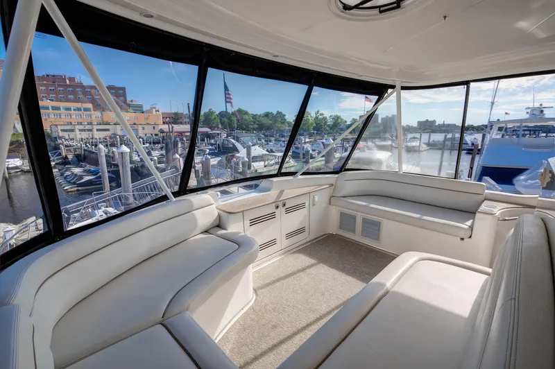  Yacht Photos Pics Interior of 2006 Silverton 50 Convertible yacht with spacious seating and marina view.