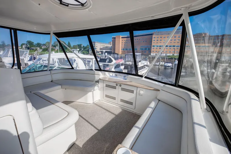  Yacht Photos Pics Interior of 2006 Silverton 50 Convertible yacht with spacious seating and panoramic windows.