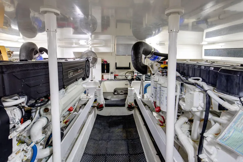  Yacht Photos Pics Engine room of a 2006 Silverton 50 Convertible yacht, showcasing dual engines and mechanical systems.