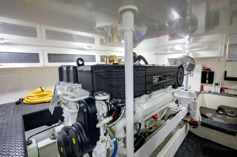  Yacht Photos Pics Engine room of a 2006 Silverton 50 Convertible yacht, showcasing a well-maintained engine.