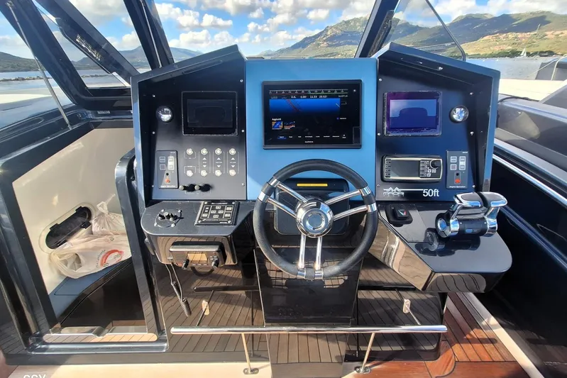 African Yacht Photos Pics Cockpit of 2017 Maori 50 T-Top yacht with modern navigation controls.