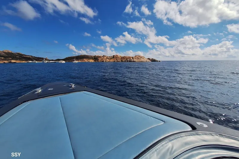 African Yacht Photos Pics 2017 Maori 50 T-Top yacht cruising on a sunny day with scenic coastal view.