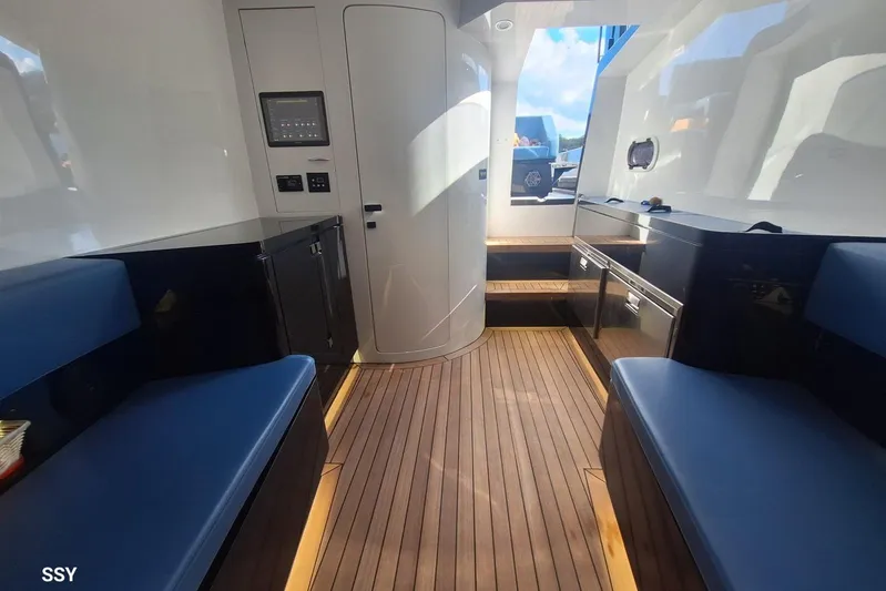 African Yacht Photos Pics Interior of 2017 Maori 50 T-Top yacht with sleek design and wooden flooring.