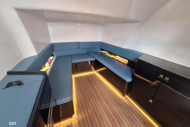 African Yacht Photos Pics Luxurious interior of 2017 Maori 50 T-Top yacht with blue seating and wooden flooring.