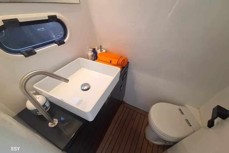 African Yacht Photos Pics Luxurious bathroom in 2017 Maori 50 T-Top yacht with modern sink and toilet.