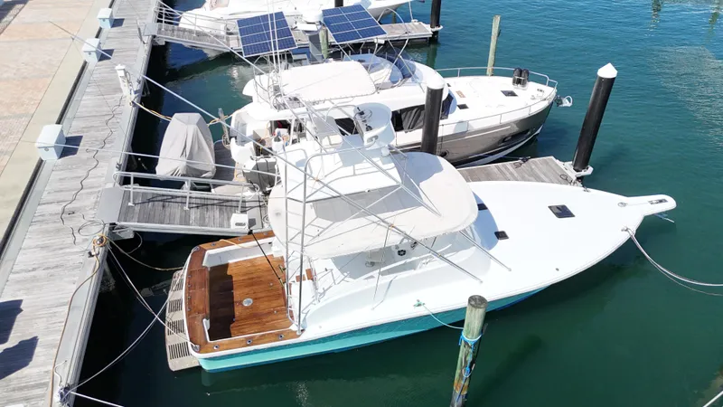  Yacht Photos Pics Aerial view of a 1997 Strike 42 yacht docked at a marina.