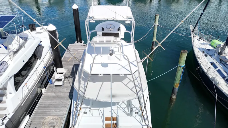  Yacht Photos Pics Aerial view of a 1997 Strike 42 boat docked at a marina.