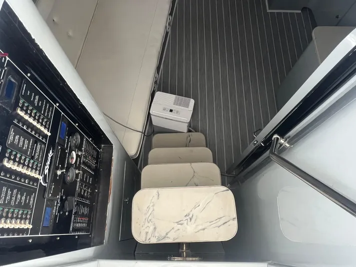  Yacht Photos Pics Interior of a 1997 Strike 42 boat with control panel and marble steps.