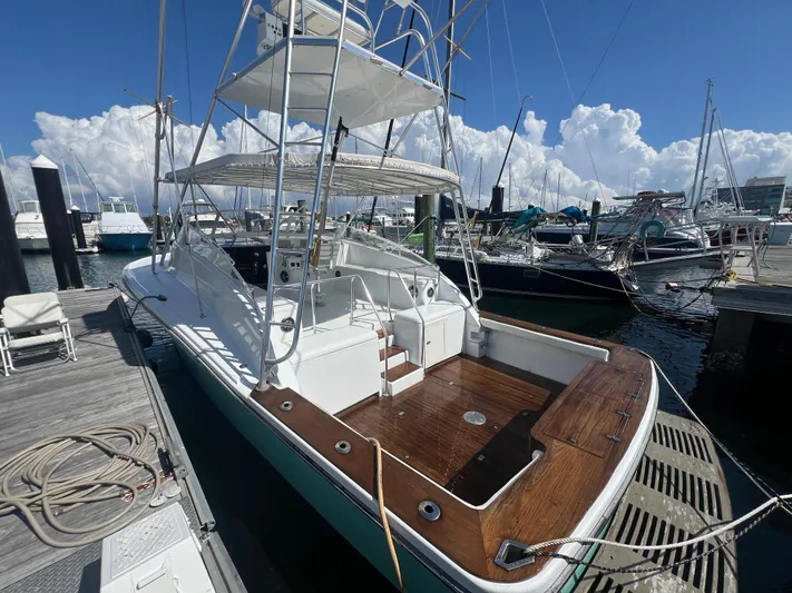  Yacht Photos Pics 1997 Strike 42 boat docked at marina under clear blue sky.