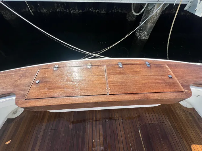  Yacht Photos Pics Wooden deck of a 1997 Strike 42 boat with storage compartments.