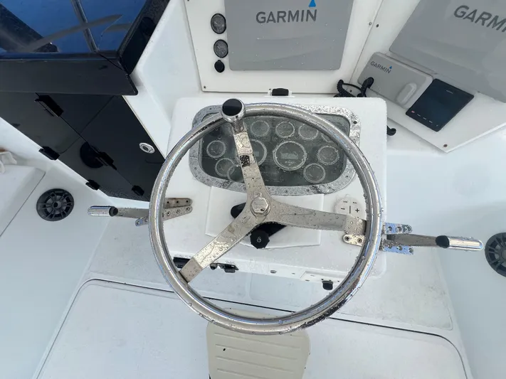  Yacht Photos Pics Steering wheel of a 1997 Strike 42 boat with Garmin navigation system.