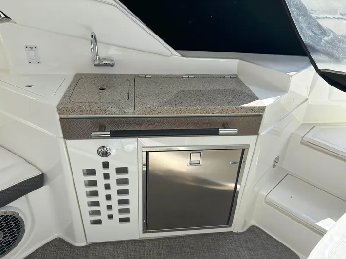  Yacht Photos Pics 2016 Sea Ray 350 SLX boat kitchenette with sink and mini fridge.