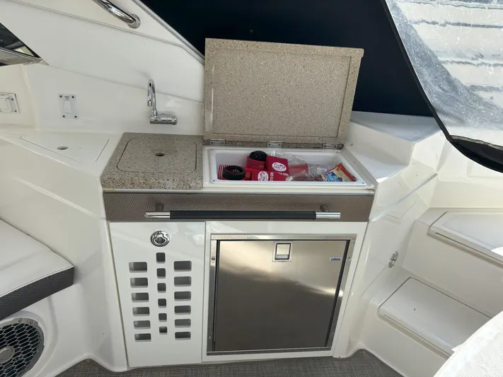  Yacht Photos Pics 2016 Sea Ray 350 SLX boat interior with kitchenette and mini fridge.
