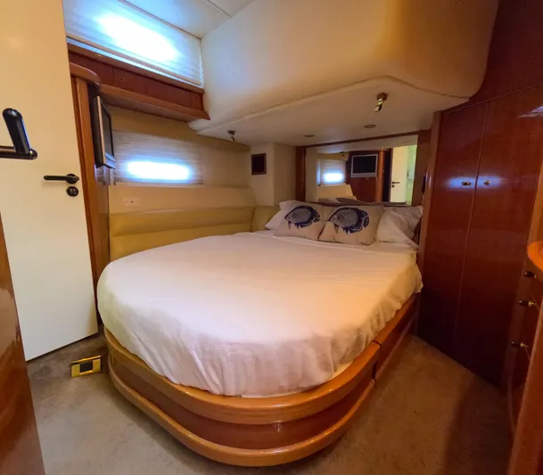 Seafari Yacht Photos Pics Luxurious bedroom interior of a 2004 Sealine 47 yacht with cozy double bed.