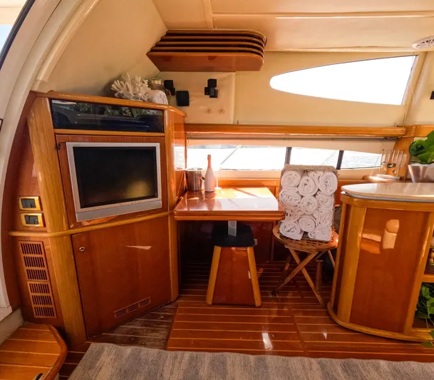 Seafari Yacht Photos Pics Luxurious interior of 2004 Sealine 47 yacht with wood finishes and modern amenities.