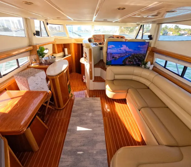 Seafari Yacht Photos Pics Luxurious interior of a 2004 Sealine 47 yacht with leather seating and wooden accents.