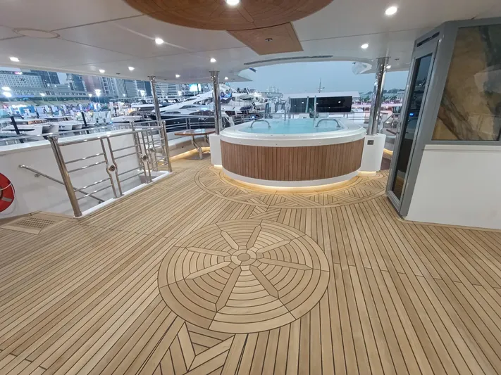 Sehamia Yacht Photos Pics Luxurious deck of 2018 Gulf Craft Majesty 155 yacht with hot tub and elegant wood flooring.