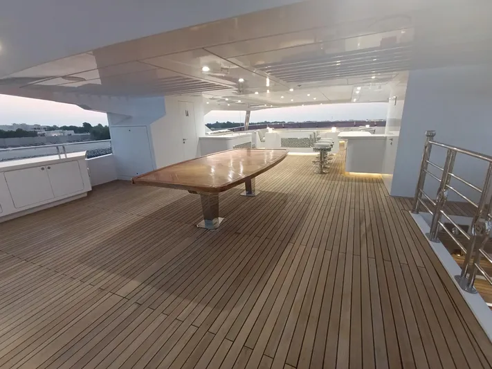 Sehamia Yacht Photos Pics Spacious deck of 2018 Gulf Craft Majesty 155 yacht with wooden flooring and modern lighting.
