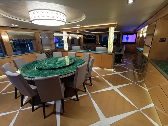 Sehamia Yacht Photos Pics Luxurious interior of 2018 Gulf Craft Majesty 155 yacht with elegant dining area and modern decor.
