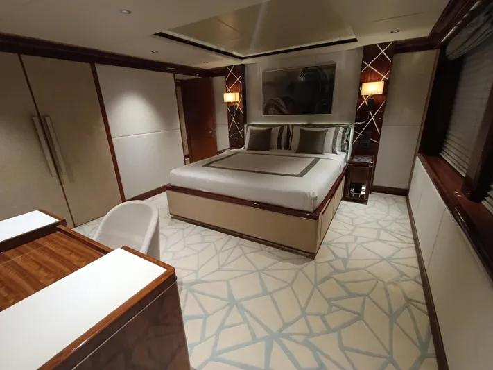 Sehamia Yacht Photos Pics Luxurious bedroom interior on 2018 Gulf Craft Majesty 155 yacht, featuring elegant decor and modern furnishings.