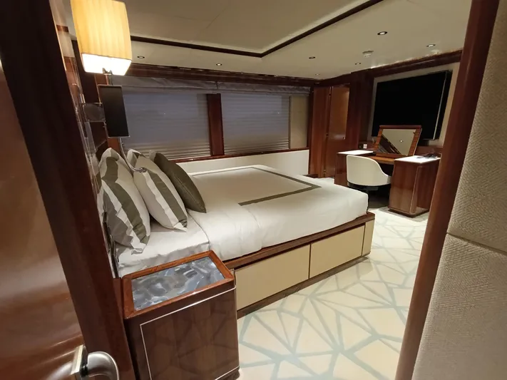 Sehamia Yacht Photos Pics Luxurious bedroom interior on 2018 Gulf Craft Majesty 155 yacht, featuring elegant furnishings and decor.
