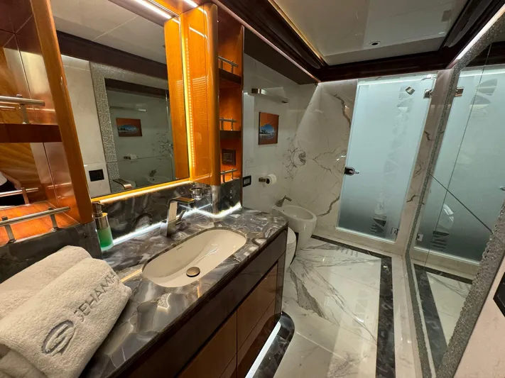 Sehamia Yacht Photos Pics Luxurious bathroom on 2018 Gulf Craft Majesty 155 yacht with marble accents and modern fixtures.