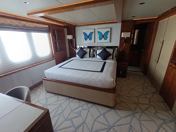 Sehamia Yacht Photos Pics Luxurious bedroom on 2018 Gulf Craft Majesty 155 yacht with elegant decor and butterfly artwork.