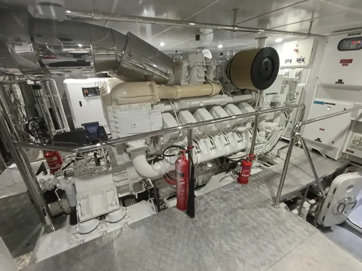 Sehamia Yacht Photos Pics Engine room of 2018 Gulf Craft Majesty 155 yacht, featuring machinery and safety equipment.