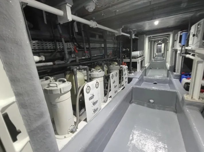 Sehamia Yacht Photos Pics Engine room of 2018 Gulf Craft Majesty 155 yacht, showcasing mechanical systems and equipment.