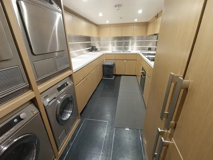 Sehamia Yacht Photos Pics Laundry and kitchen area inside a 2018 Gulf Craft Majesty 155 yacht.
