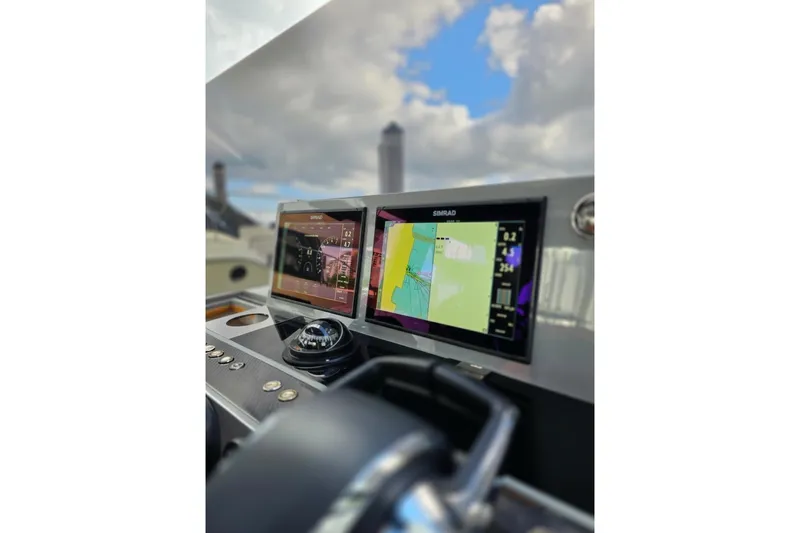 Never Enough Yacht Photos Pics 2023 De Antonio Yachts D42 Open dashboard with navigation screens and controls.