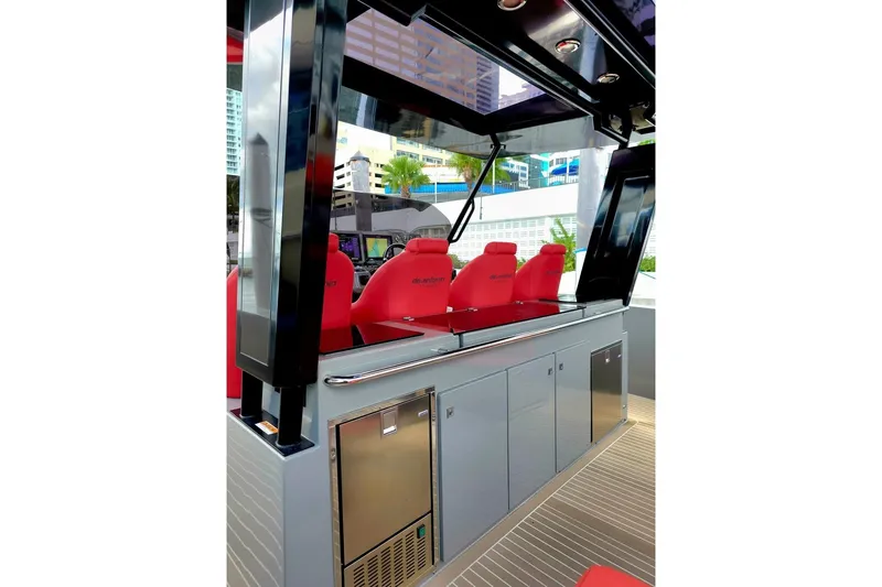 Never Enough Yacht Photos Pics 2023 De Antonio Yachts D42 Open interior with red seating and sleek cabinetry.