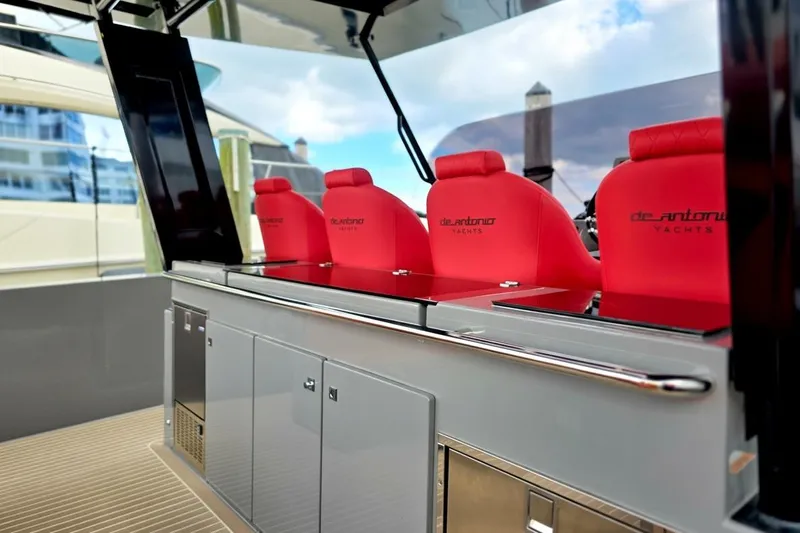 Never Enough Yacht Photos Pics 2023 De Antonio Yachts D42 Open with red seating and sleek design.