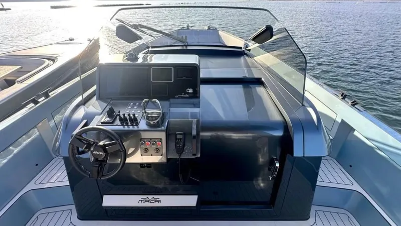  Yacht Photos Pics 2024 Maori 46ft yacht cockpit with modern controls, steering wheel, and ocean view.