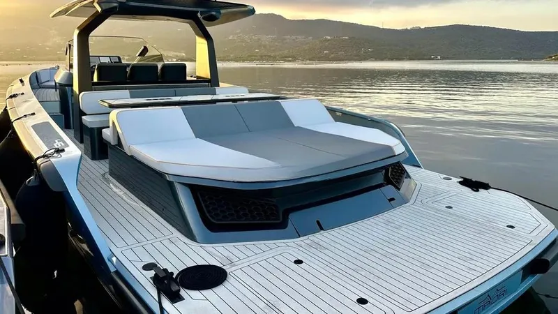  Yacht Photos Pics 2024 Maori 46ft yacht with sleek design, docked on calm water at sunset.