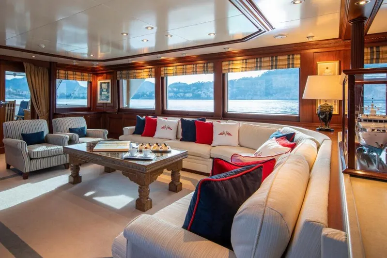  Yacht Photos Pics Luxurious 1982 Feadship Classic yacht interior with elegant seating and scenic ocean views.