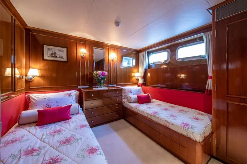  Yacht Photos Pics Luxurious 1982 Feadship Classic yacht cabin with twin beds and elegant wood paneling.