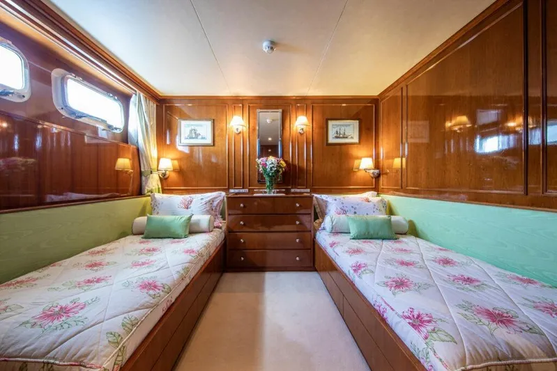  Yacht Photos Pics Luxurious 1982 Feadship Classic yacht cabin with twin beds and elegant wood paneling.