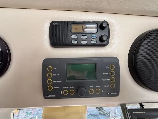 Island Dreamer Yacht Photos Pics Control panel in a 1999 Riviera Convertible boat with radio and navigation systems.